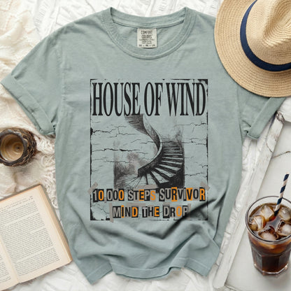 "House of Wind" t-shirt with spiral staircase and text "10,000 Steps Survivor Mind the Drop".