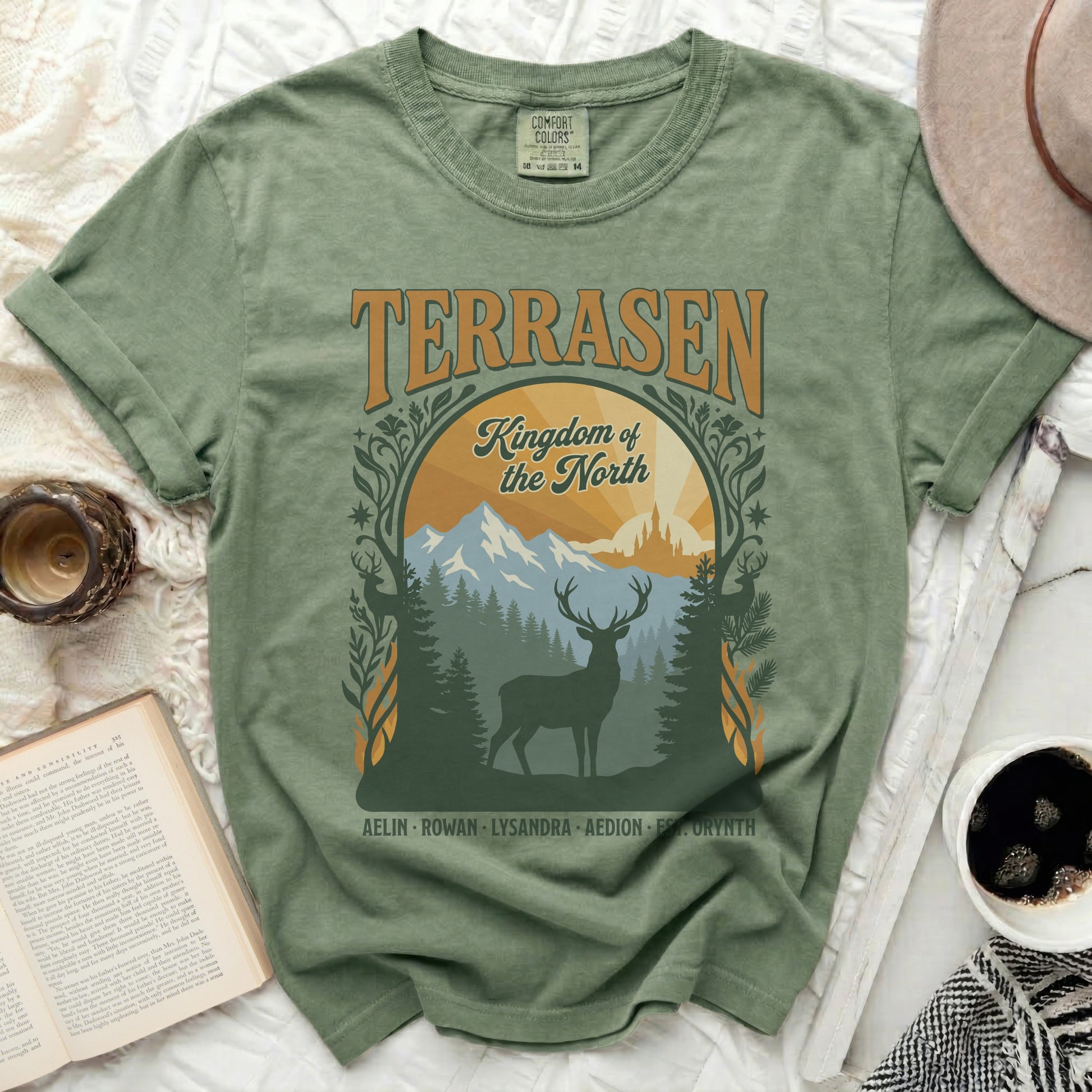 Green t-shirt with "Terrasen Kingdom of the North" and deer graphic.