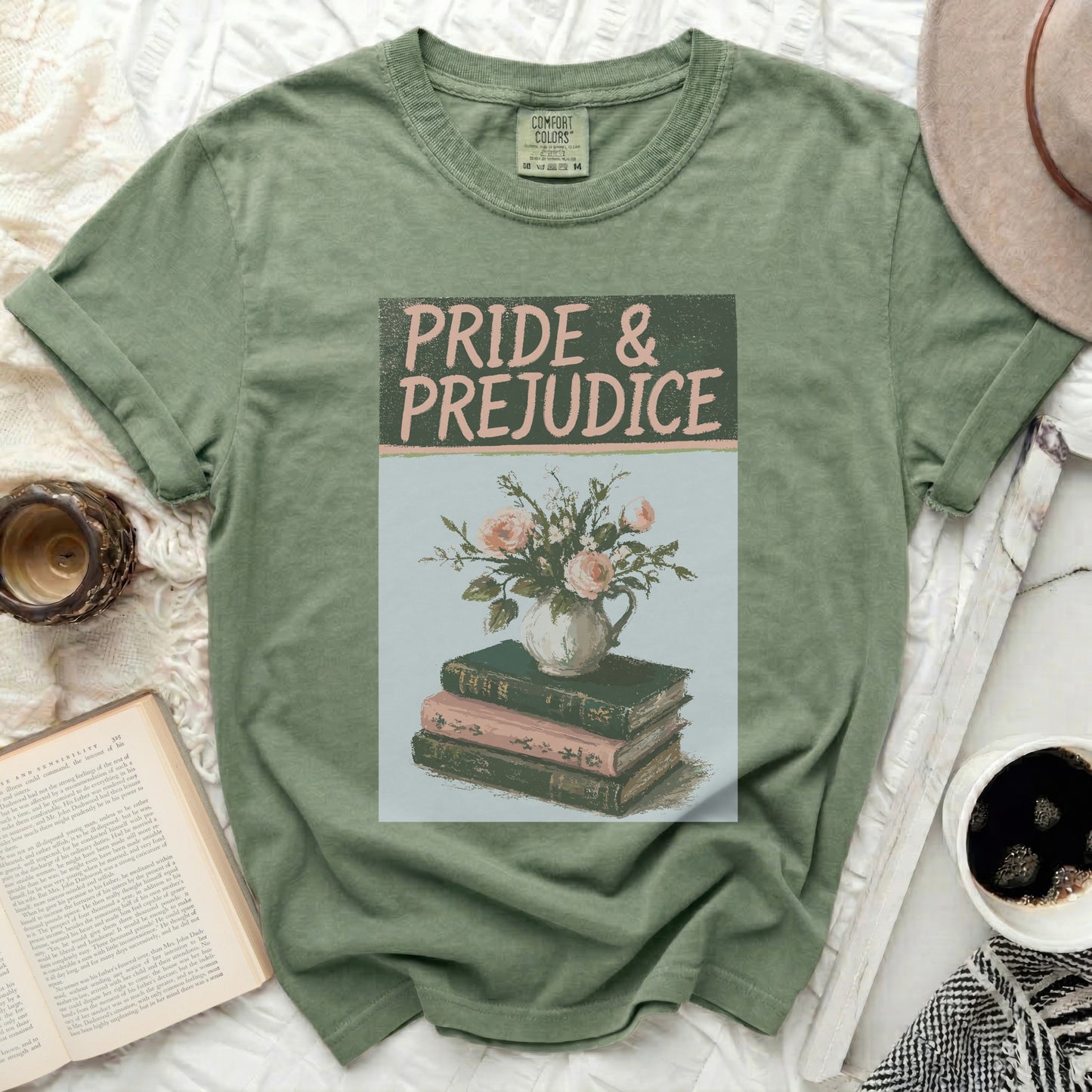 Green t-shirt with "Pride & Prejudice" and floral book graphic.