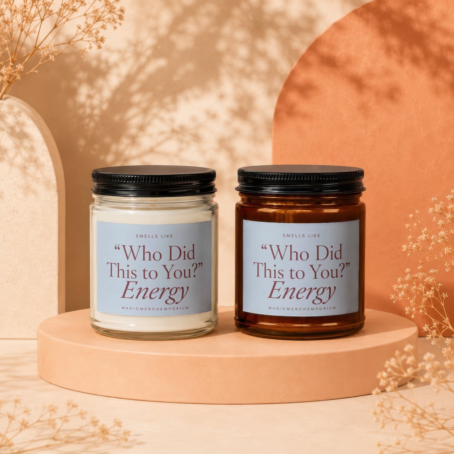 Two candles, one clear and one amber, with labels reading "Energy" and "Who Did This to You?".