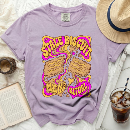 Purple t-shirt with "Stale Biscuit Mating Ritual" graphic.