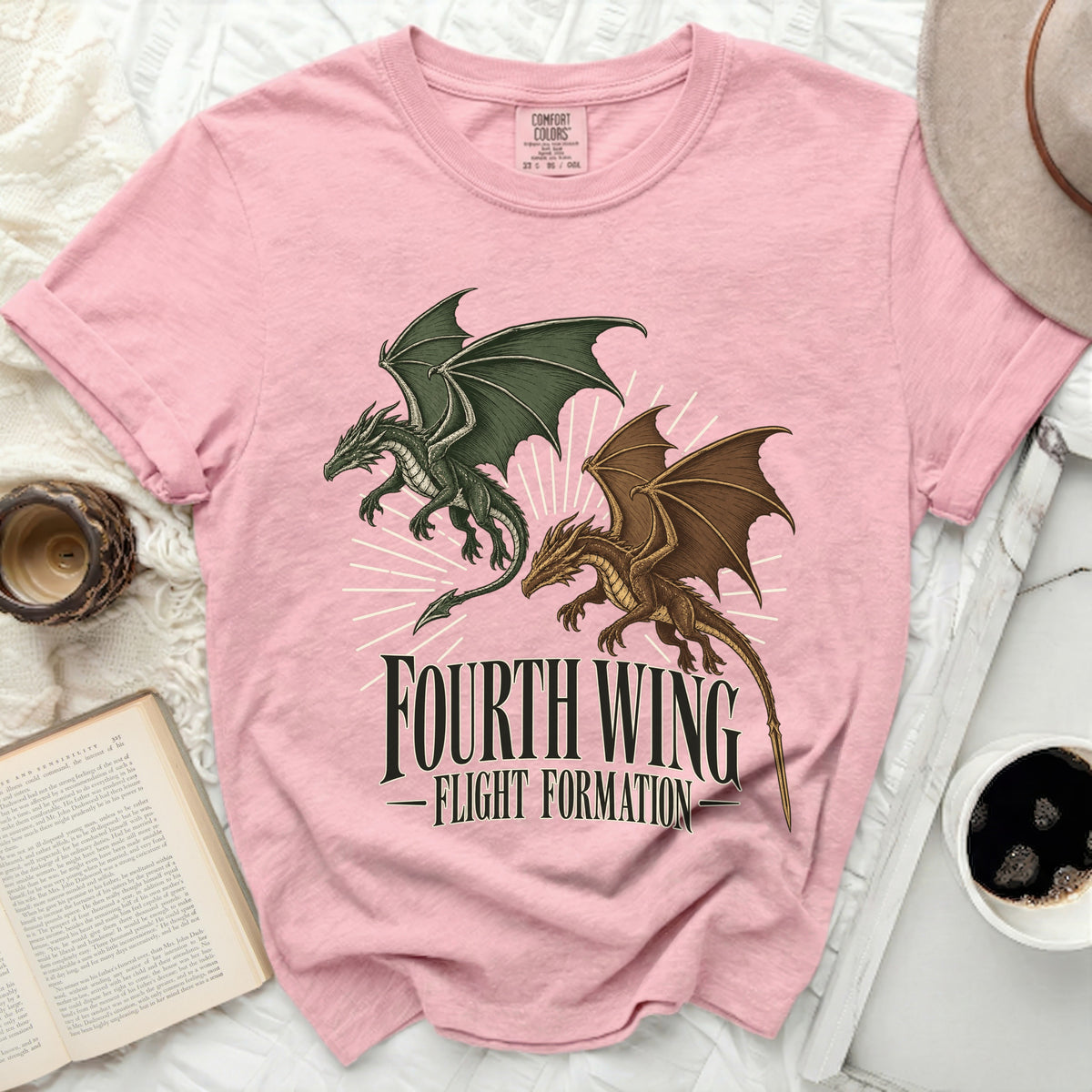 Pink crewneck t-shirt featuring a green and a brown dragon with the text "Fourth Wing Flight Formation".