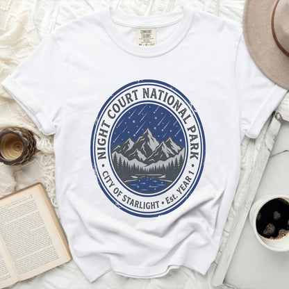 White t-shirt with "Night Court National Park City of Starlight" circular graphic.