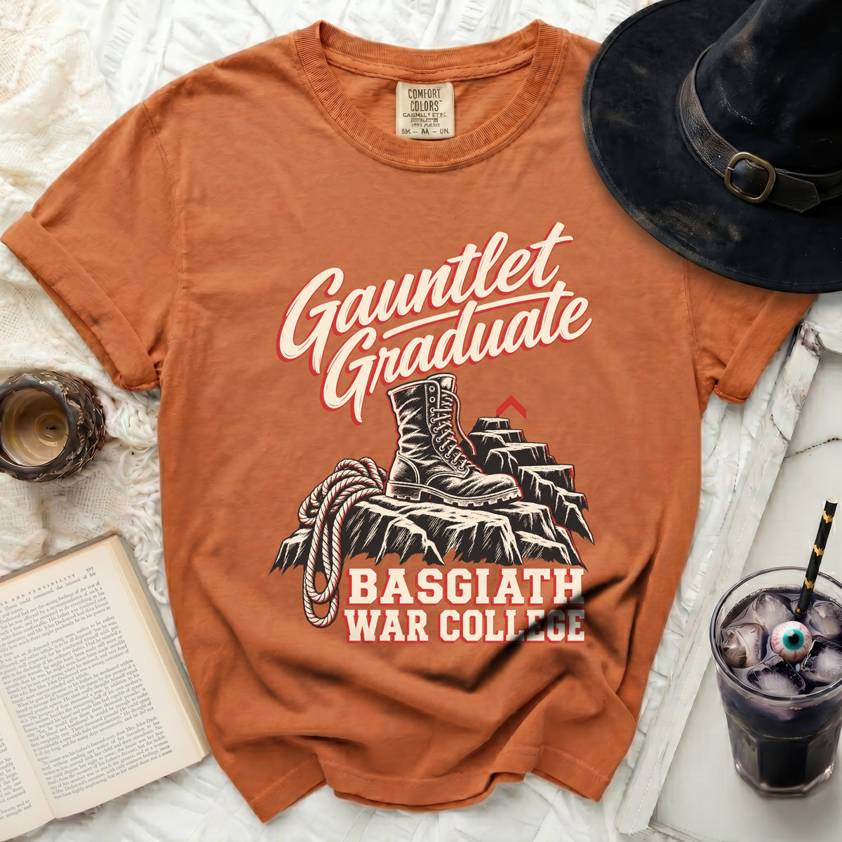 Orange t-shirt with "Gauntlet Graduate Basgiath War College" text and boot graphic.
