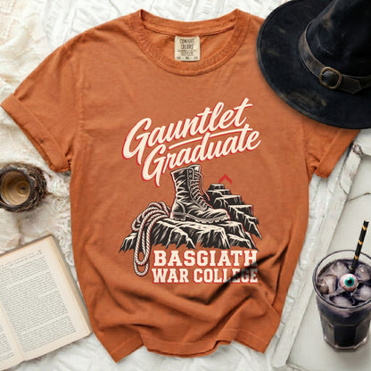 Orange t-shirt with "Gauntlet Graduate Basgiath War College" text and boot graphic.