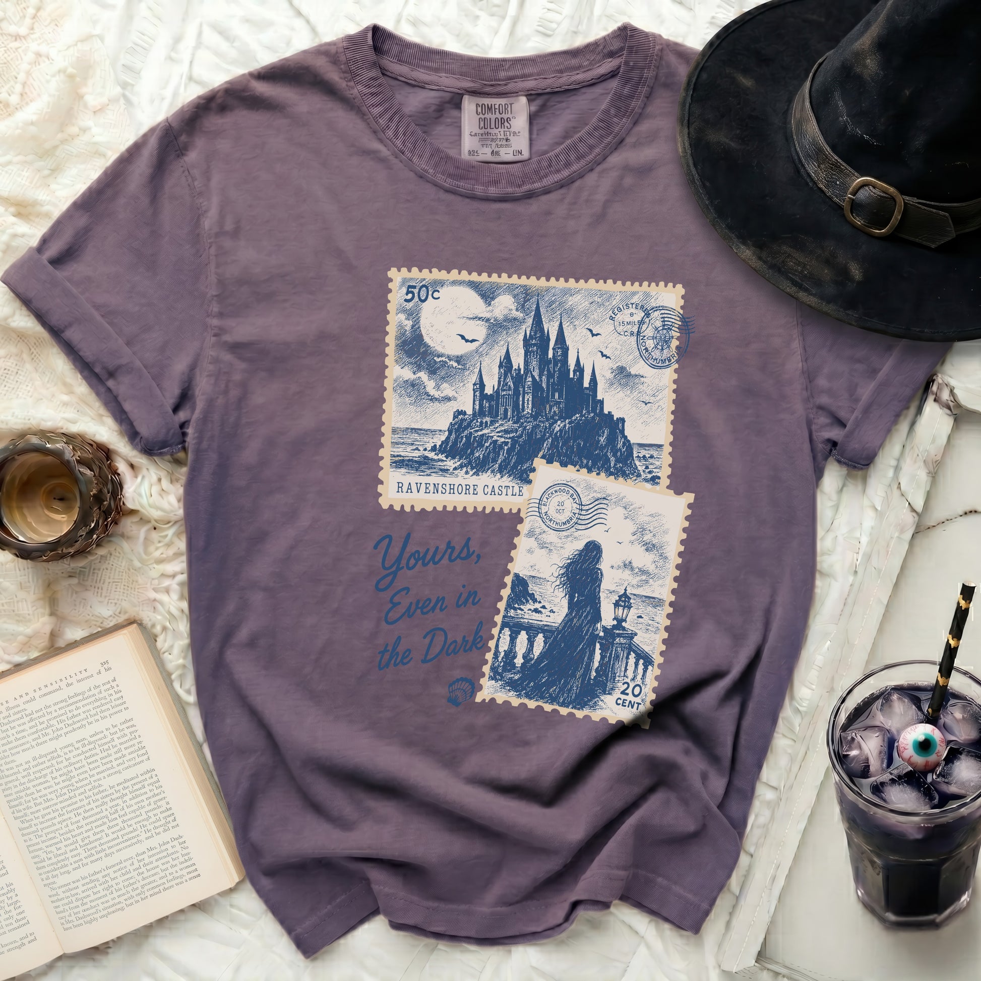 Purple t-shirt with "Ravenshore Castle" and a castle graphic.