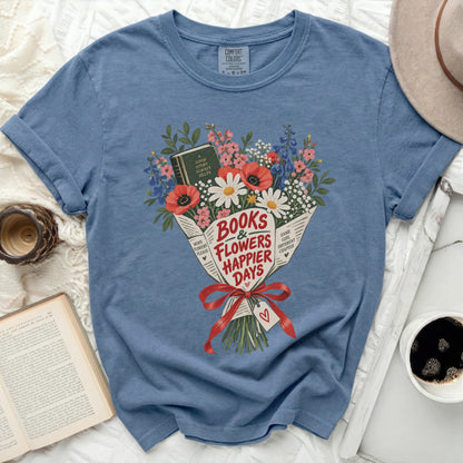 Blue t-shirt with "Books & Flowers Happier Days" graphic and a book.