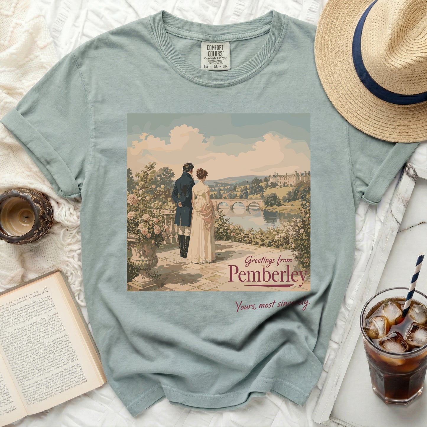 T-shirt with "Greetings from Pemberley" and couple overlooking landscape.