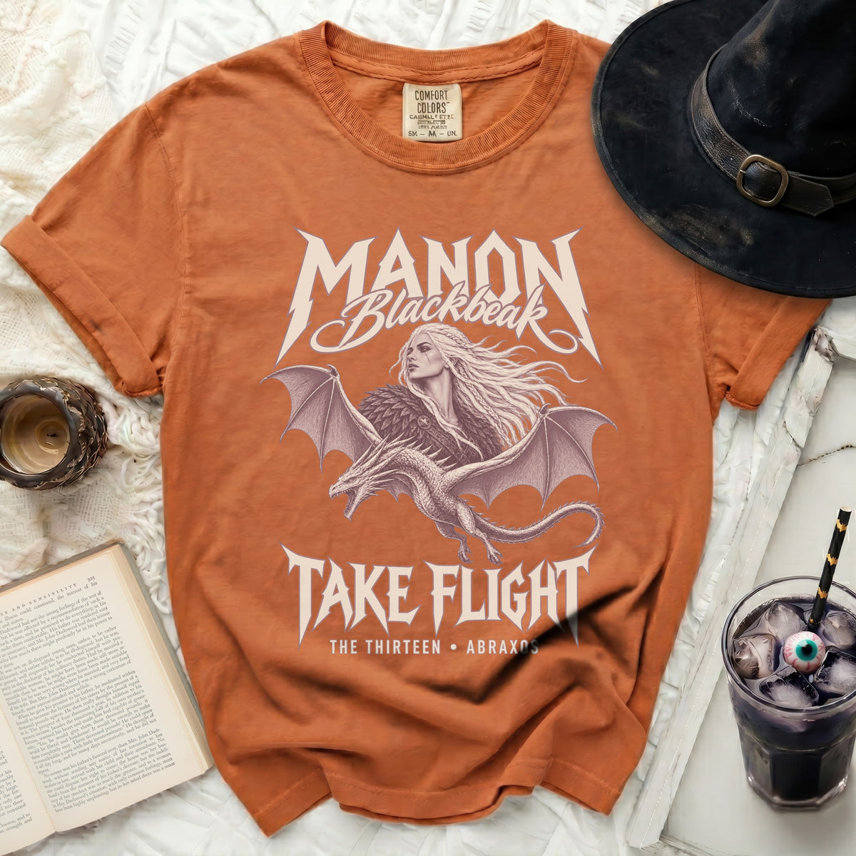Orange t-shirt with Manon Blackbeak and dragon graphic, "Take Flight".