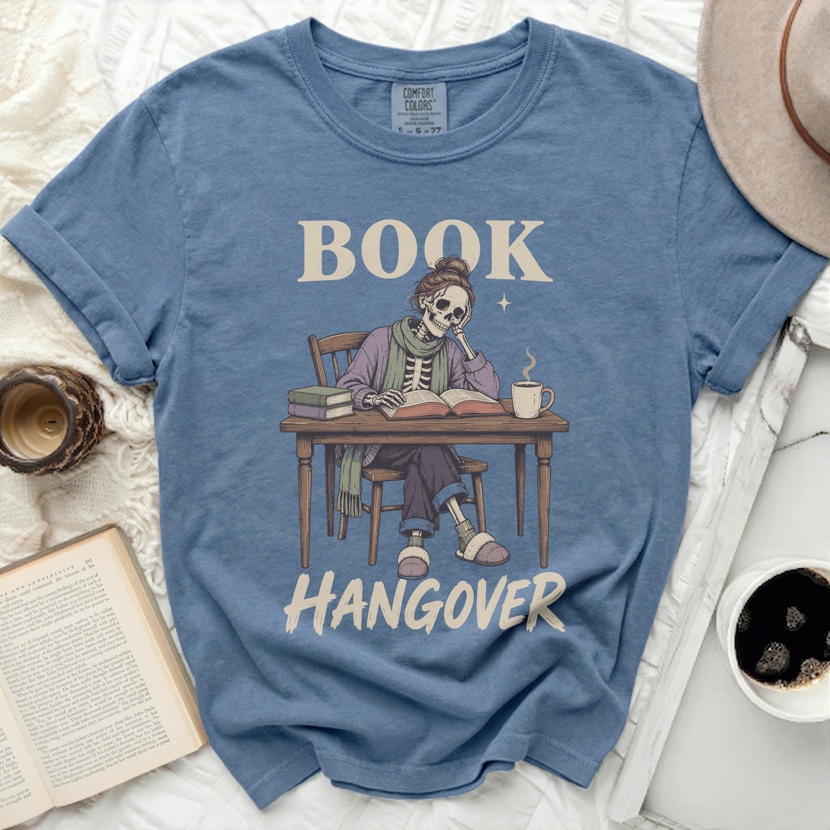 Blue t-shirt with skeleton reading, "BOOK HANGOVER" graphic.
