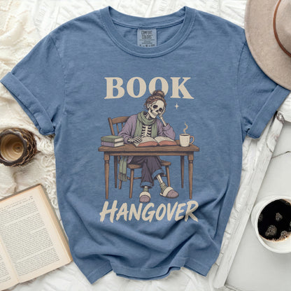 Blue t-shirt with skeleton reading, "BOOK HANGOVER" graphic.
