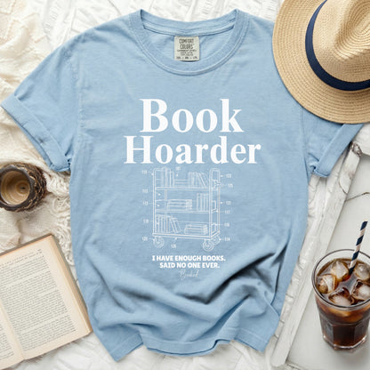 Light blue t-shirt with "Book Hoarder" and a bookshelf design.