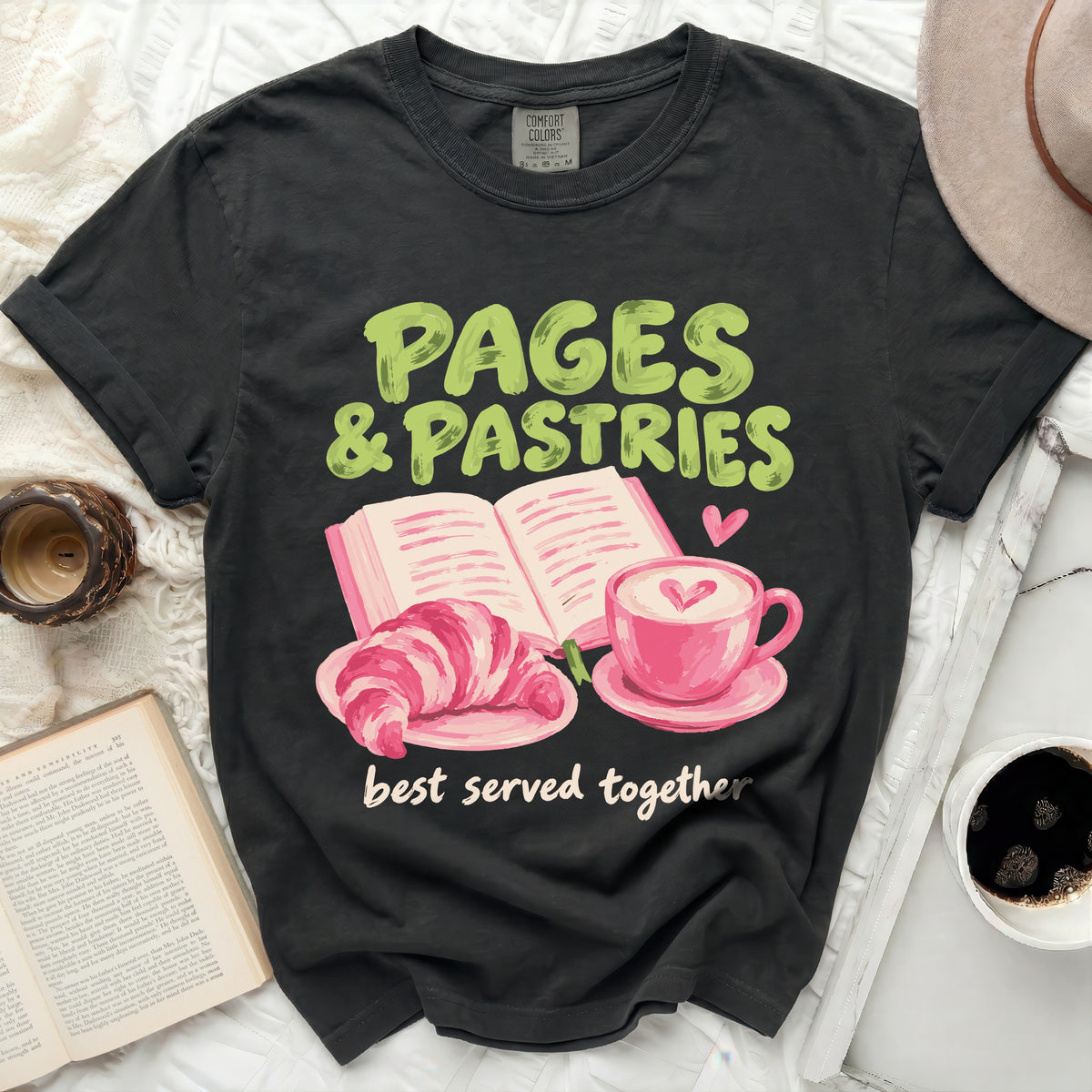 Black t-shirt with "PAGES & PASTRIES best served together" graphic.
