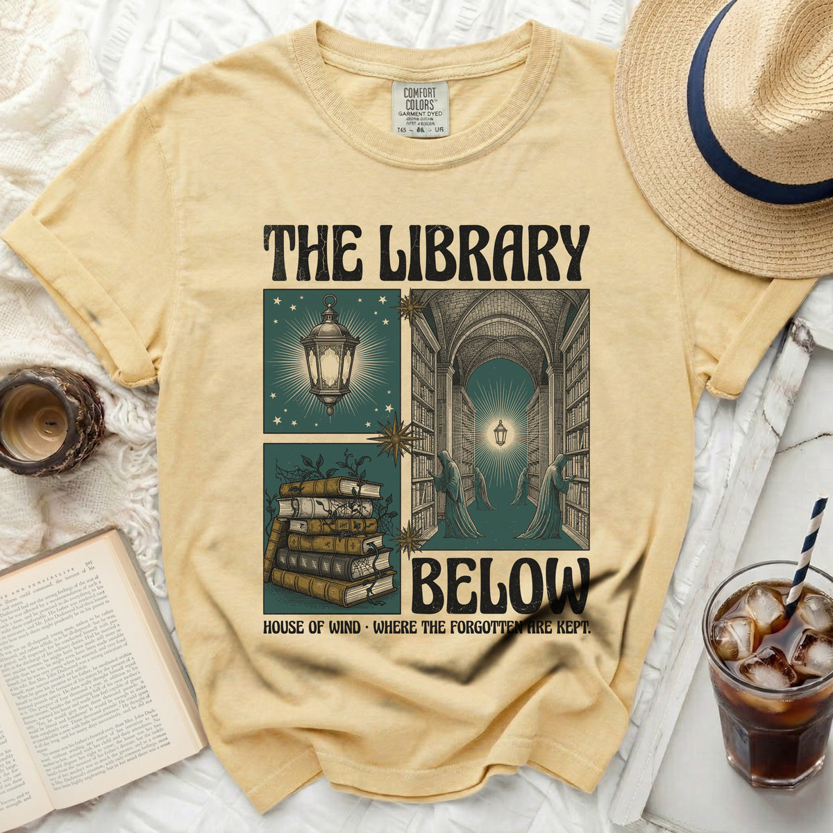 The Library Below t-shirt with vintage book and lantern graphic.