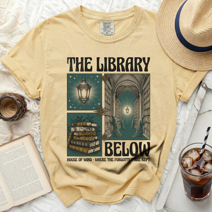 The Library Below t-shirt with vintage book and lantern graphic.