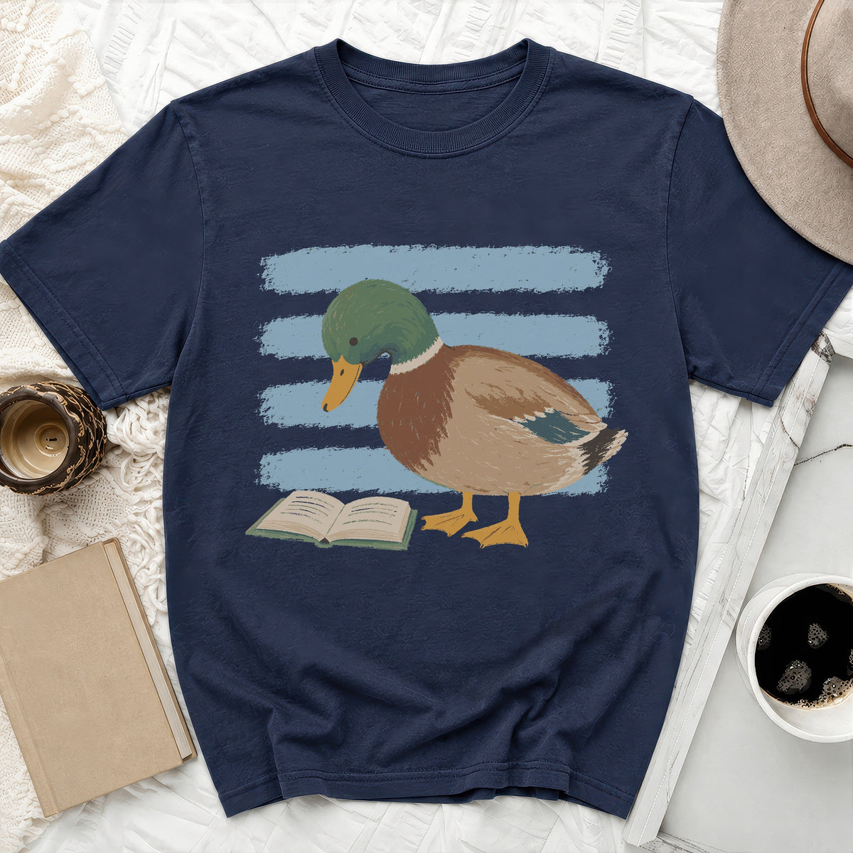 Navy t-shirt with a graphic of a mallard duck reading a book.