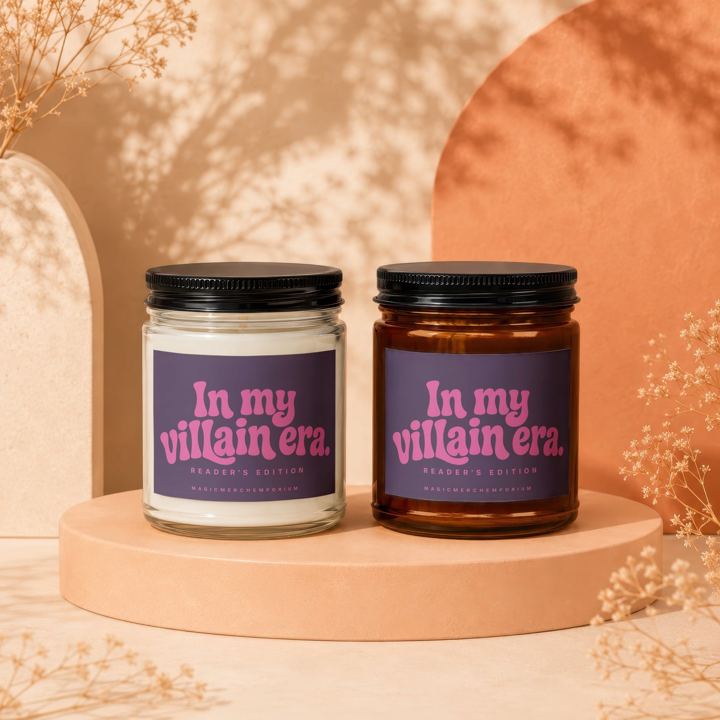 Two candles on display, one clear and one amber, with "In my villain era" text.