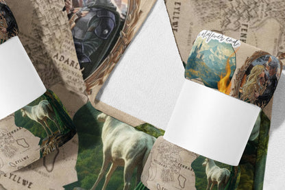 Fuzzy blanket with fantasy map, deer, and character illustrations.