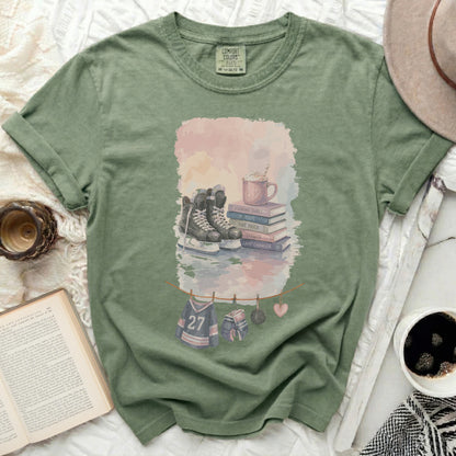 Green t-shirt with hockey skates, books, and text "PUCKING SWEET" and "GAME CHANGER".