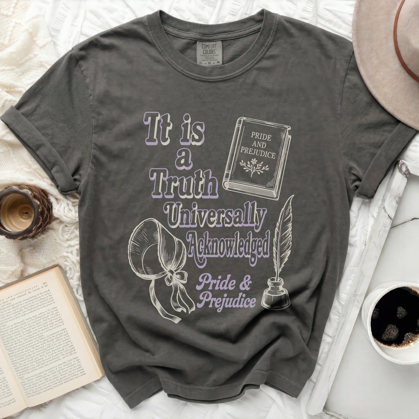 Gray t-shirt with "It is a Truth Universally Acknowledged Pride & Prejudice" graphic.