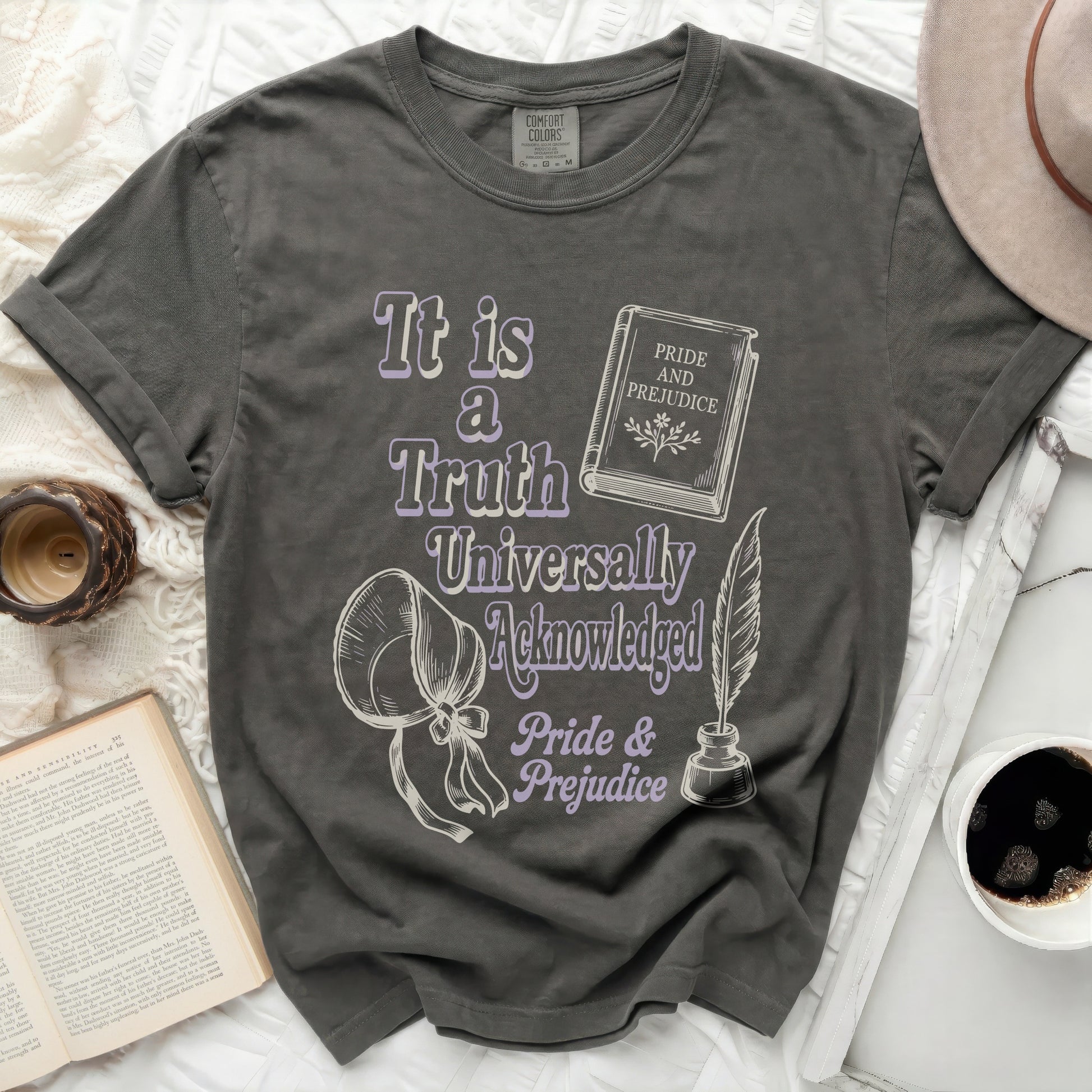 Gray t-shirt with "It is a Truth Universally Acknowledged Pride & Prejudice" graphic.