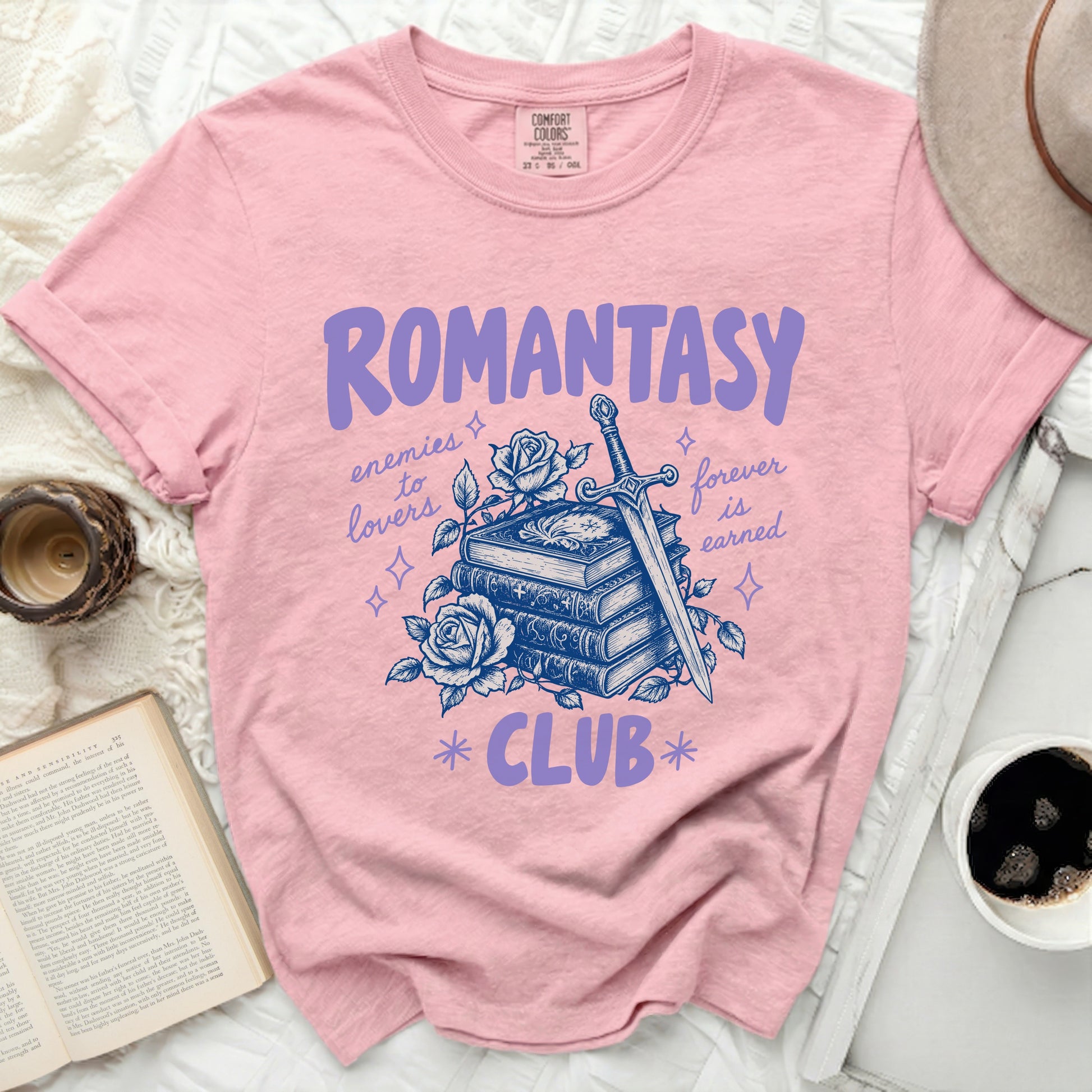 Pink t-shirt with "Romantasy Club" text, book, rose, and sword design.