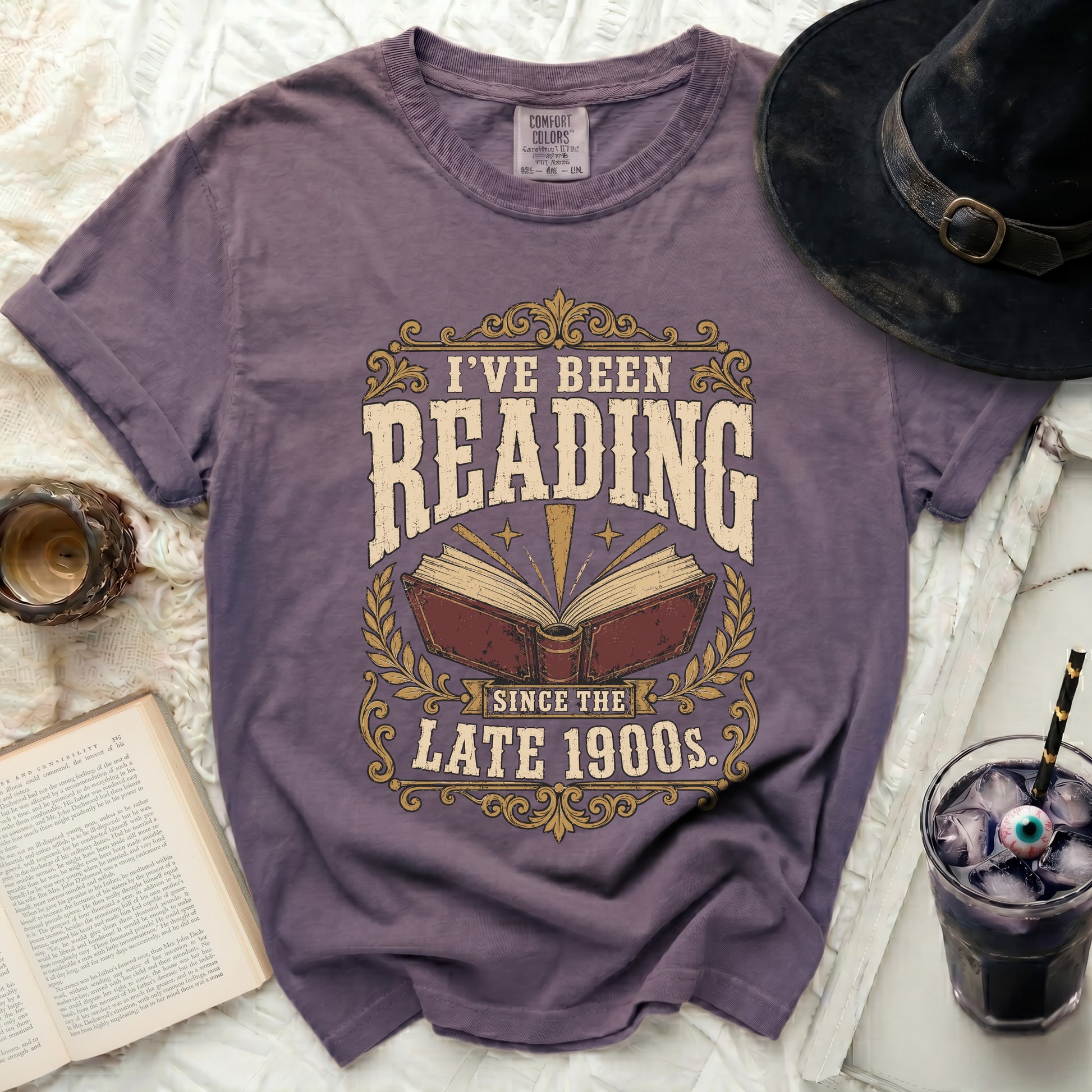 Purple t-shirt with "I've Been Reading Since the Late 1900s" graphic.