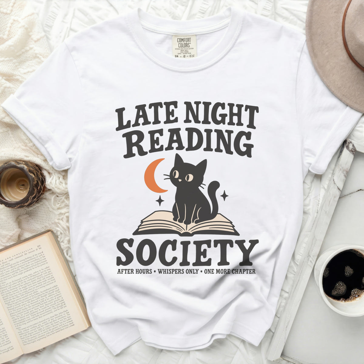 White t-shirt with "Late Night Reading Society" text and a cat on a book.