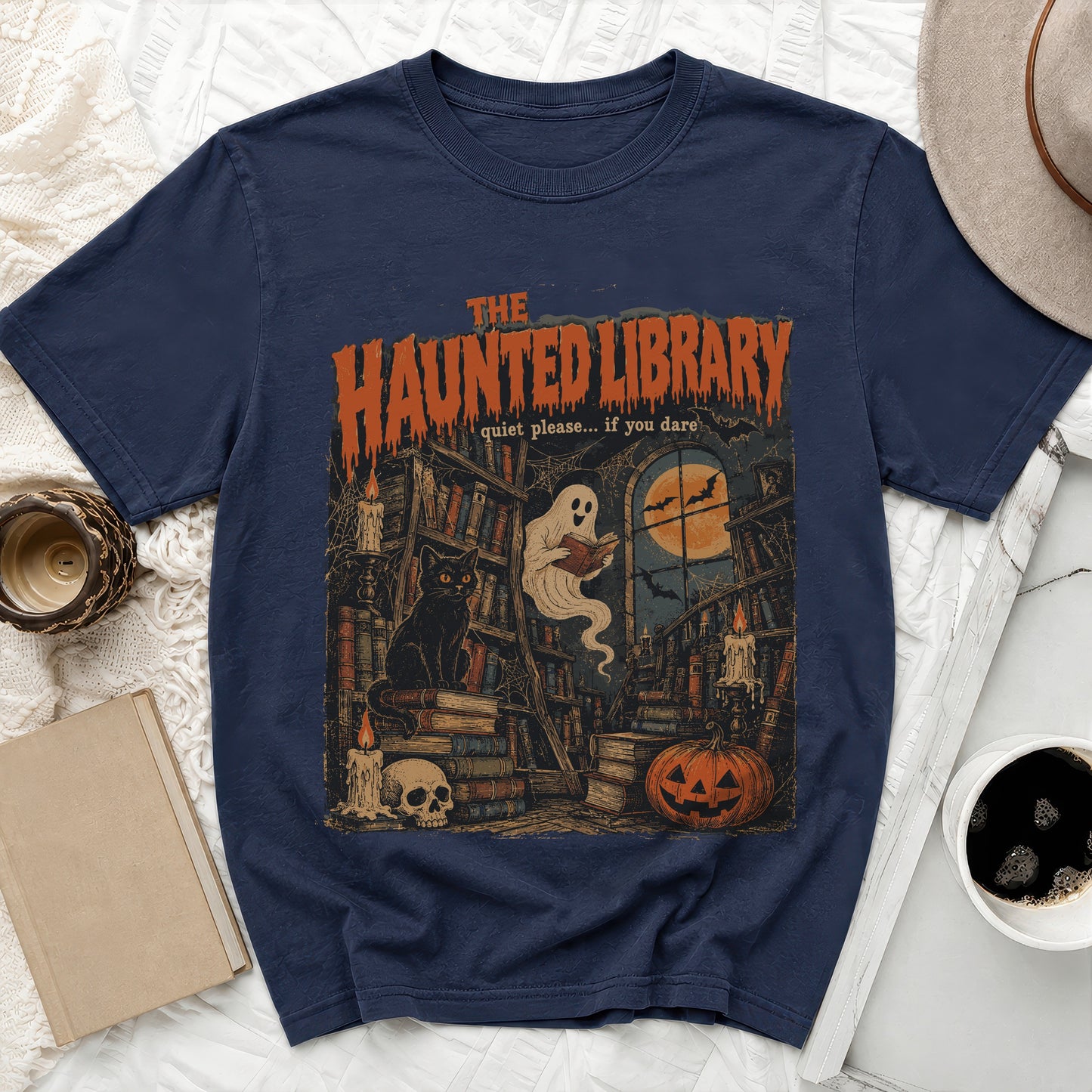 Dark t-shirt with "The Haunted Library" text and spooky library scene.