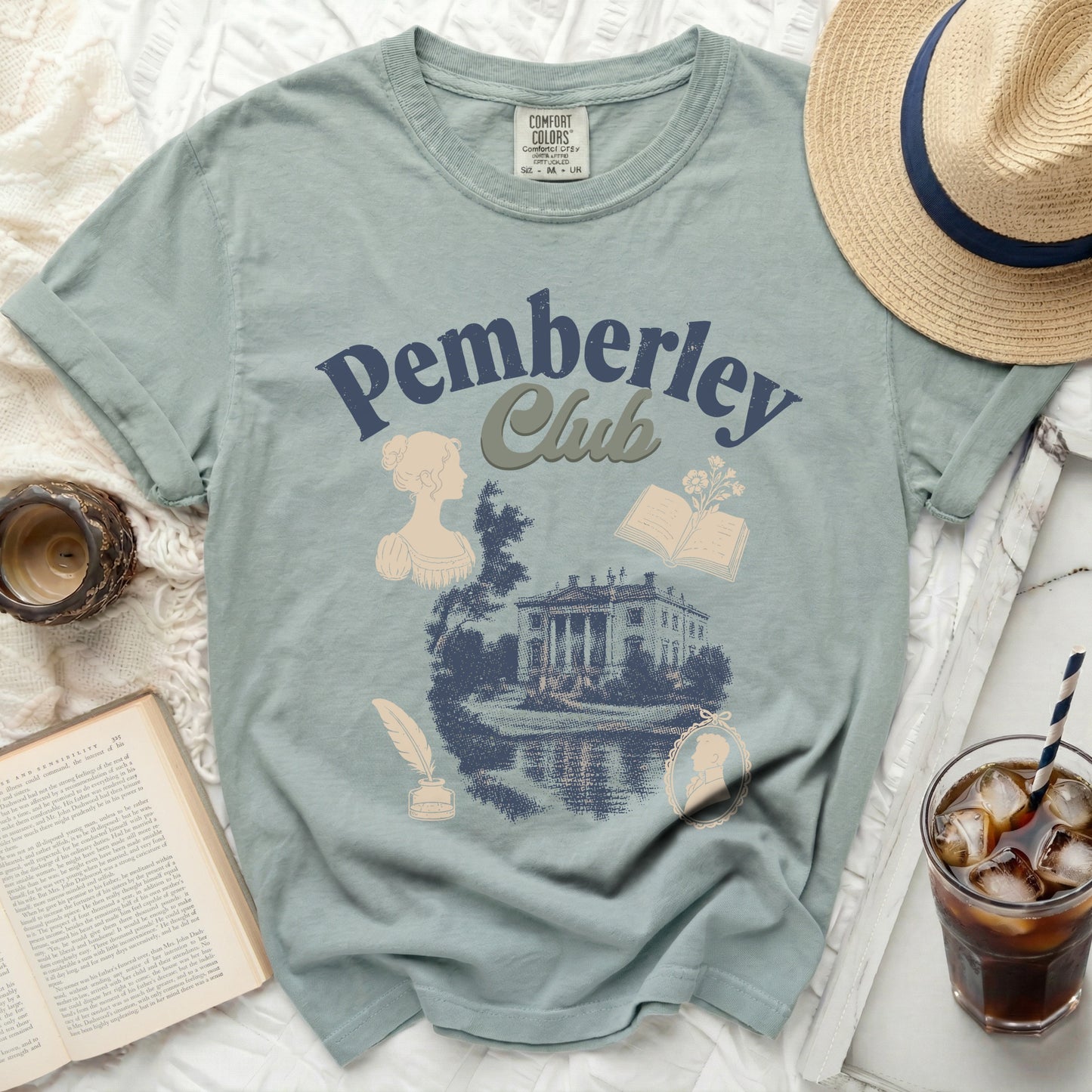 Green t-shirt with "Pemberley Club" text and vintage illustrations.