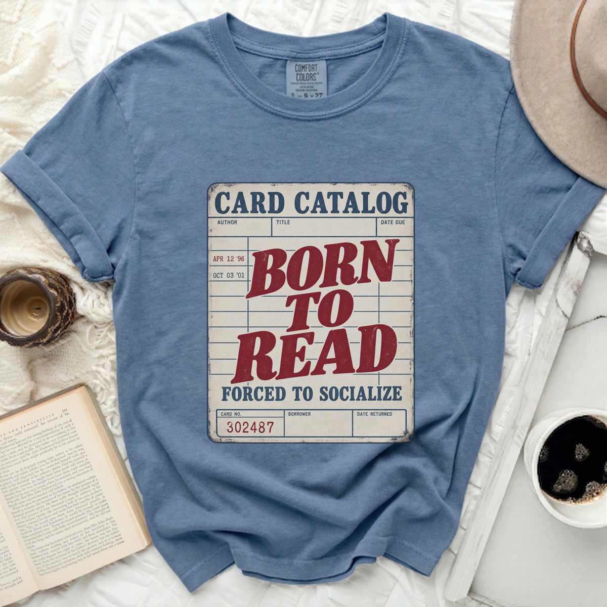Blue t-shirt with "Card Catalog Born to Read Forced to Socialize" graphic.