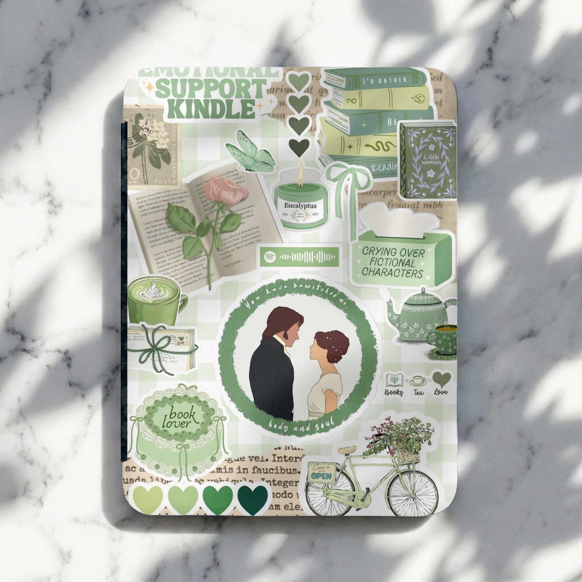 Green themed journaling stickers with books, tea, a candle, and romantic couple illustration.
