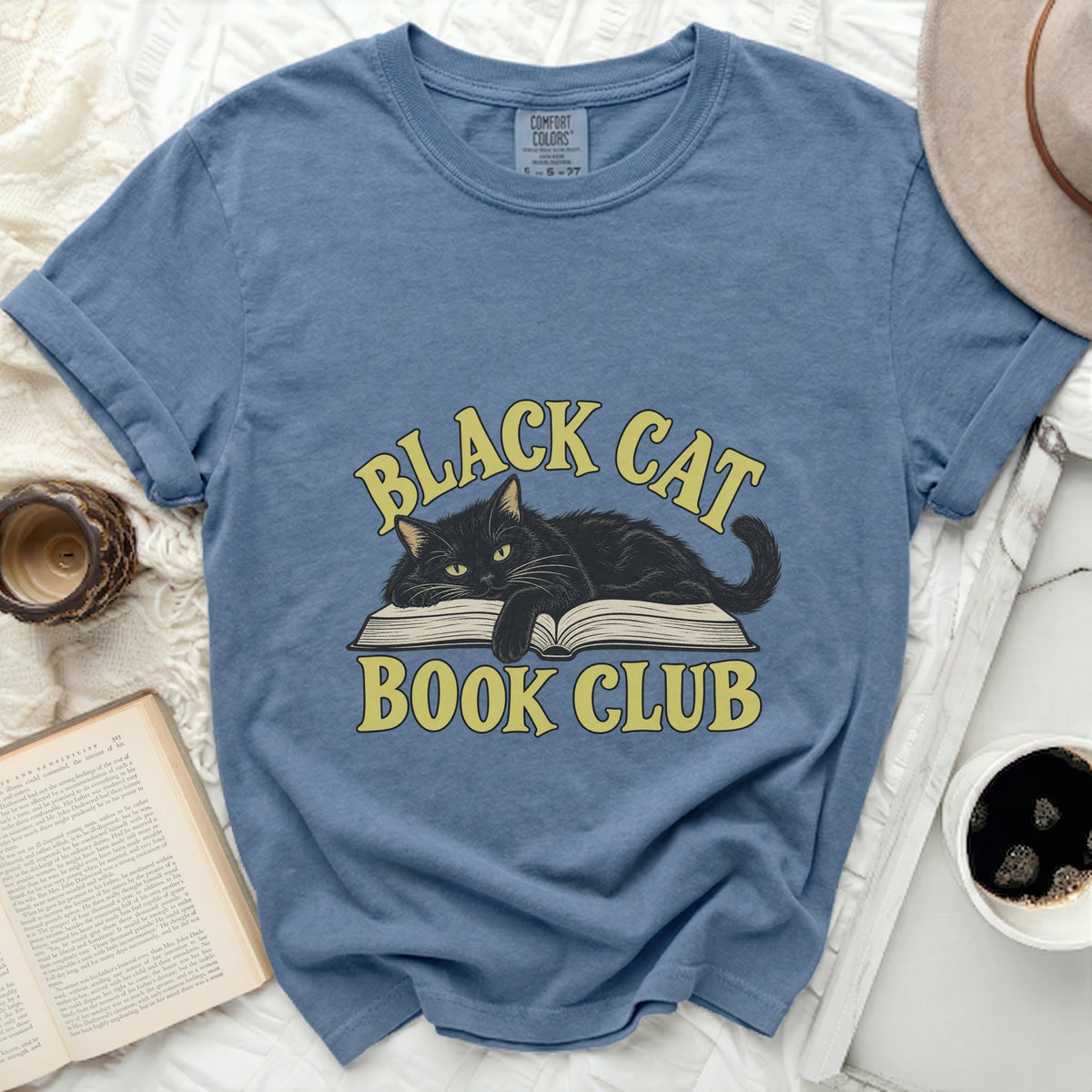 Blue t-shirt with black cat on open book, "Black Cat Book Club" text.