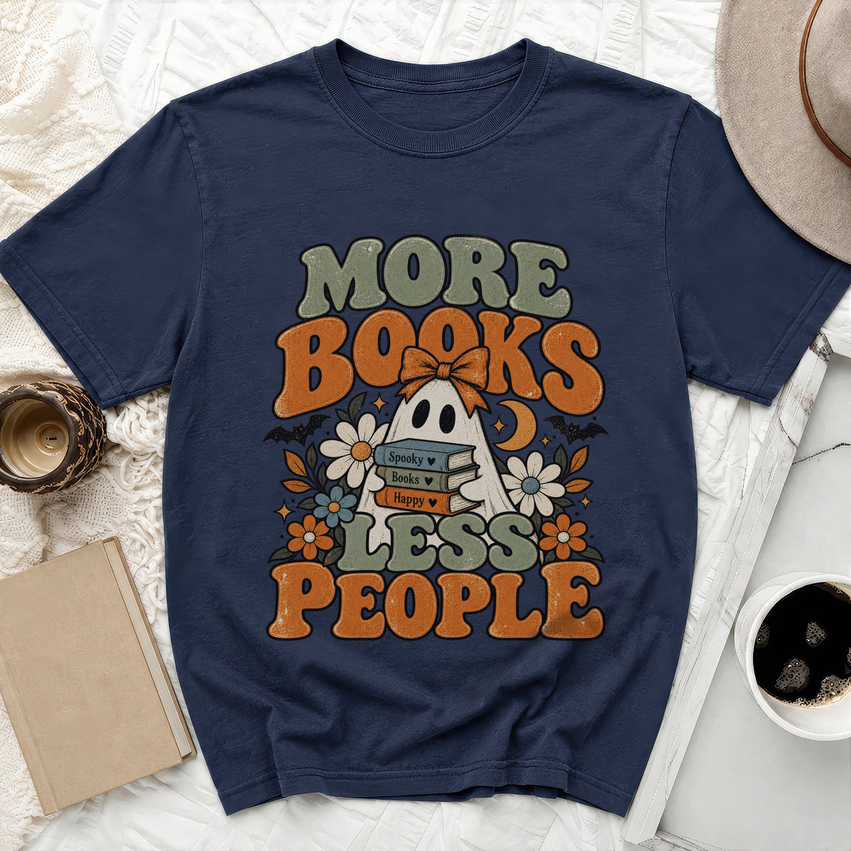 Dark navy t-shirt with "MORE BOOKS LESS PEOPLE" text and a ghost design.