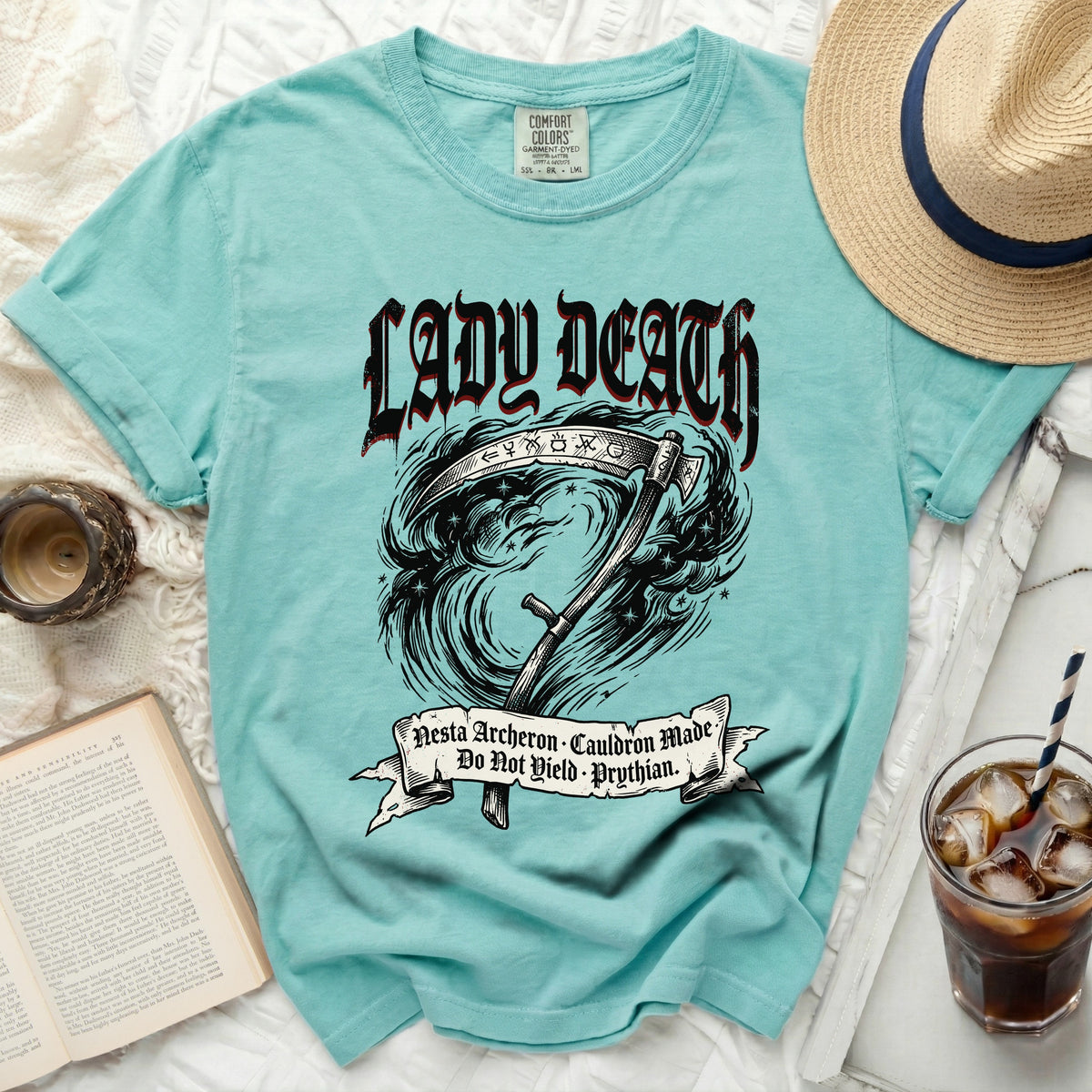 Aqua t-shirt with Lady Death graphic, scythe, and text.