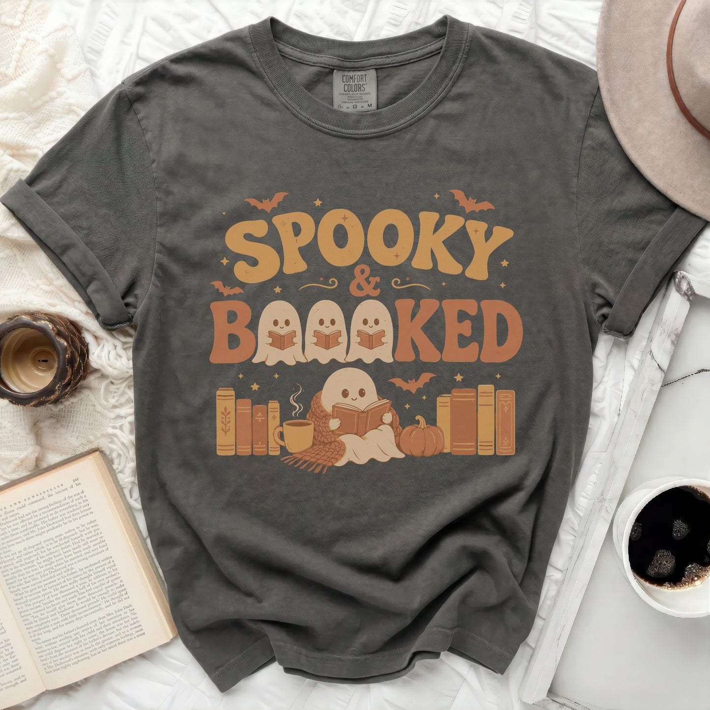Spooky & Booked graphic tee with ghosts reading books.