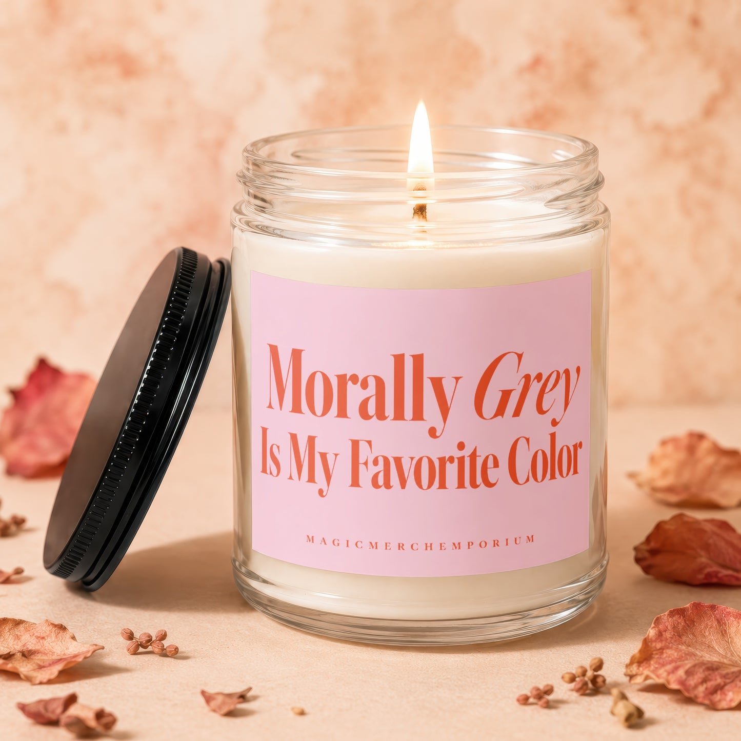 Candle with pink label reading "Morally Grey Is My Favorite Color"