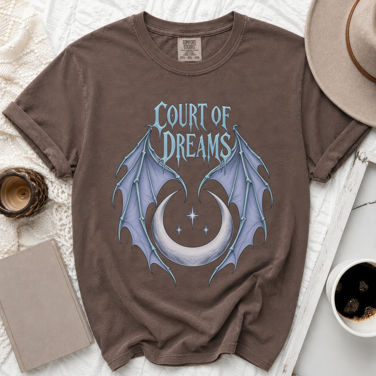 Brown t-shirt with "Court of Dreams" text and bat wings on crescent moon.