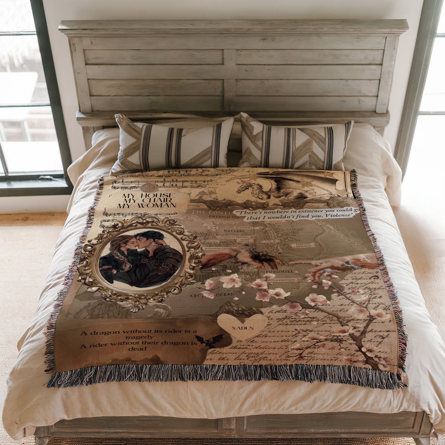 a bedroom with a bed covered in a decorative blanket that includes a dragon, a couple, and some text.
