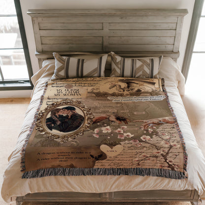 a bedroom with a bed covered in a decorative blanket that includes a dragon, a couple, and some text.