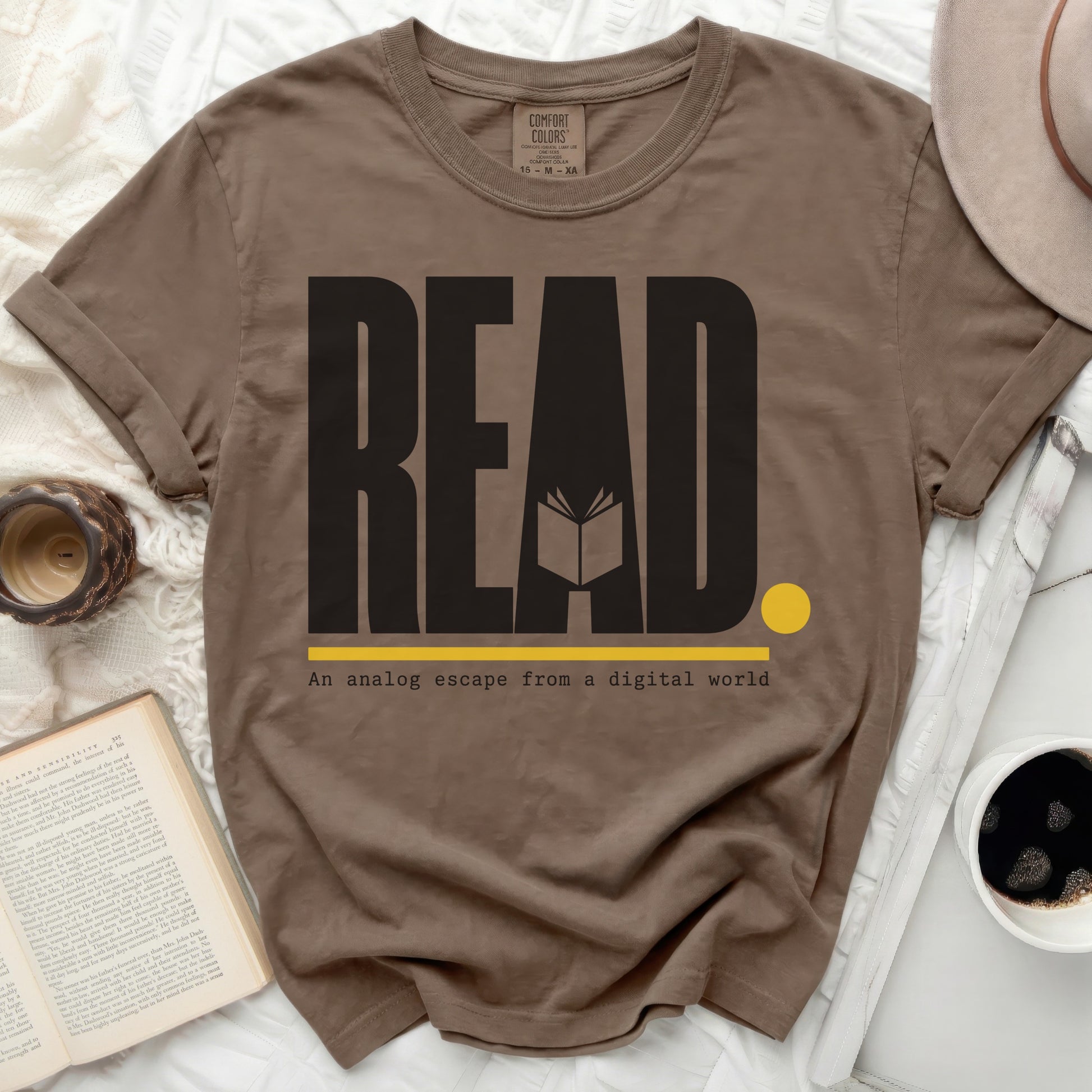 Brown t-shirt with "READ" and an open book graphic.