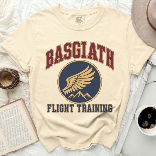 Cream t-shirt with "BASGIATH FLIGHT TRAINING" text and wing logo.