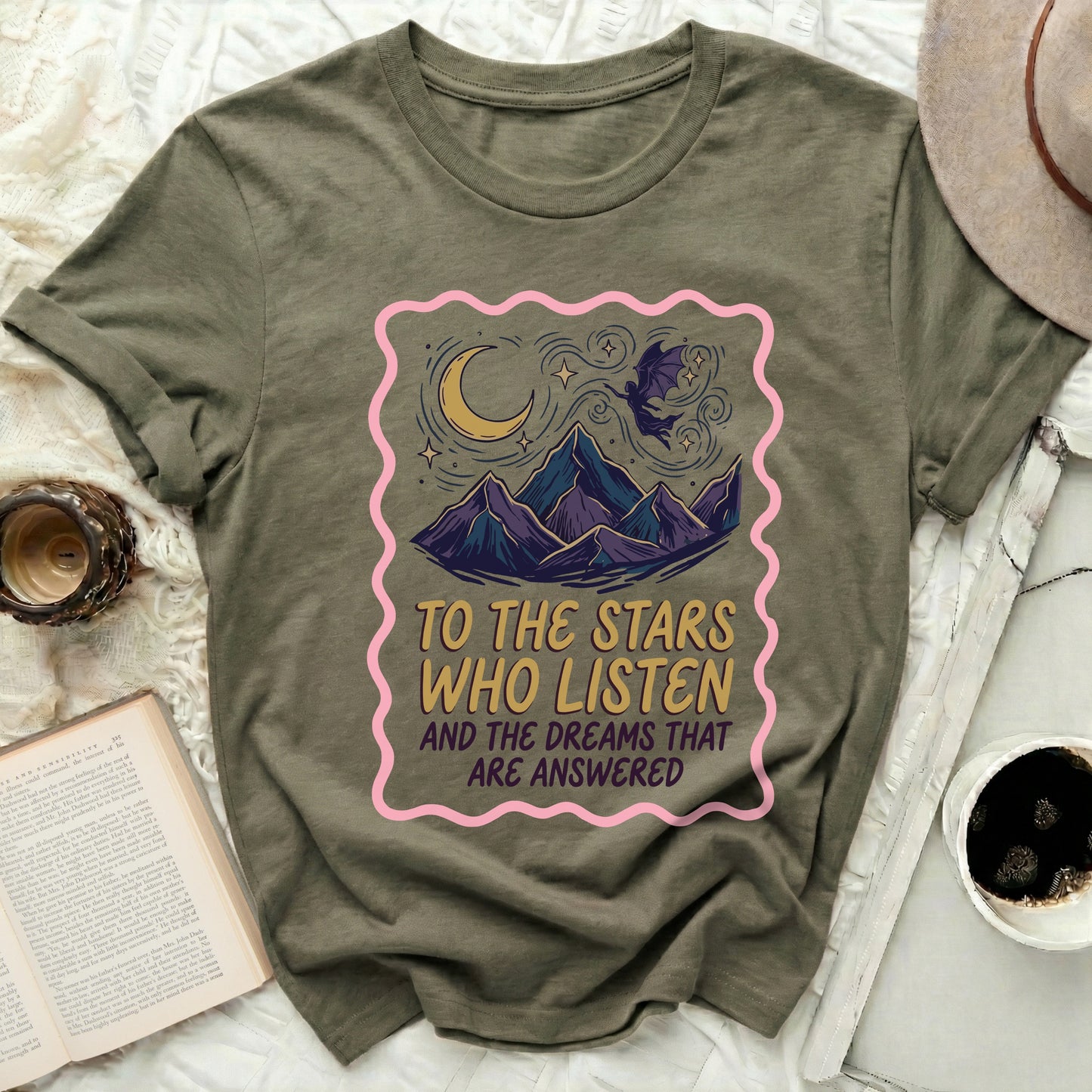 TO THE STARS WHO LISTEN AND THE DREAMS THAT ARE product type
Moon Stars Design
Mountain Art
Flying Bat Creature
Celestial Theme
Mystical Graphic
Fantasy Apparel
Inspirational Text
Dreamy Scene
Olive Green Shirt
Unique Graphic Tee
Night Sky Design
Star Gazer Shirt
Whimsical Art
Aesthetic Style
Spiritual Quote
Cosmic Vibes
Positive Message
Listen Dreams
Answered Wishes
Adventure Spirit