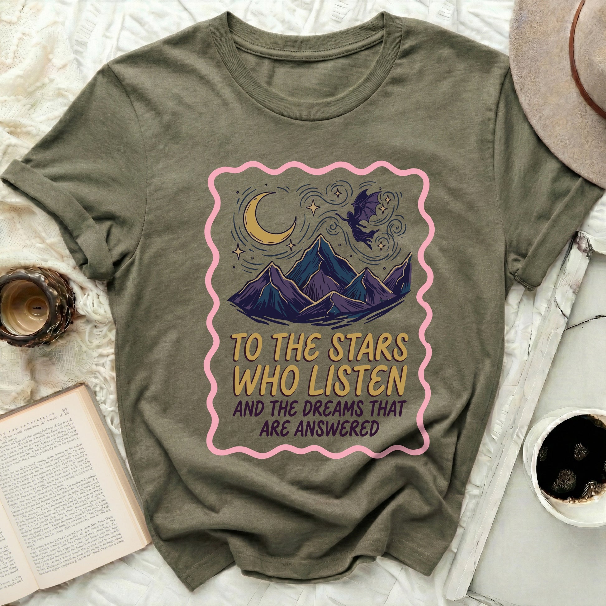 TO THE STARS WHO LISTEN AND THE DREAMS THAT ARE product type
Moon Stars Design
Mountain Art
Flying Bat Creature
Celestial Theme
Mystical Graphic
Fantasy Apparel
Inspirational Text
Dreamy Scene
Olive Green Shirt
Unique Graphic Tee
Night Sky Design
Star Gazer Shirt
Whimsical Art
Aesthetic Style
Spiritual Quote
Cosmic Vibes
Positive Message
Listen Dreams
Answered Wishes
Adventure Spirit
