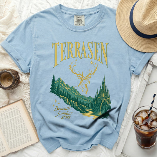 Light blue t-shirt with "TERRASEN" text, deer antlers, and a castle scene.