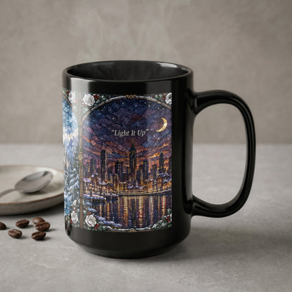 A black ceramic mug featuring a stained-glass city illustration and the text Light It Up.
