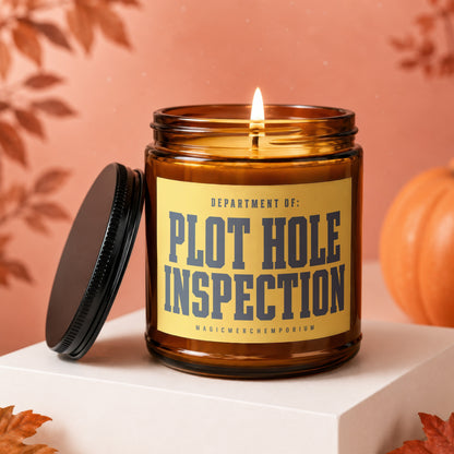 Amber jar candle with lit wick and lid, text "PLOT HOLE INSPECTION"