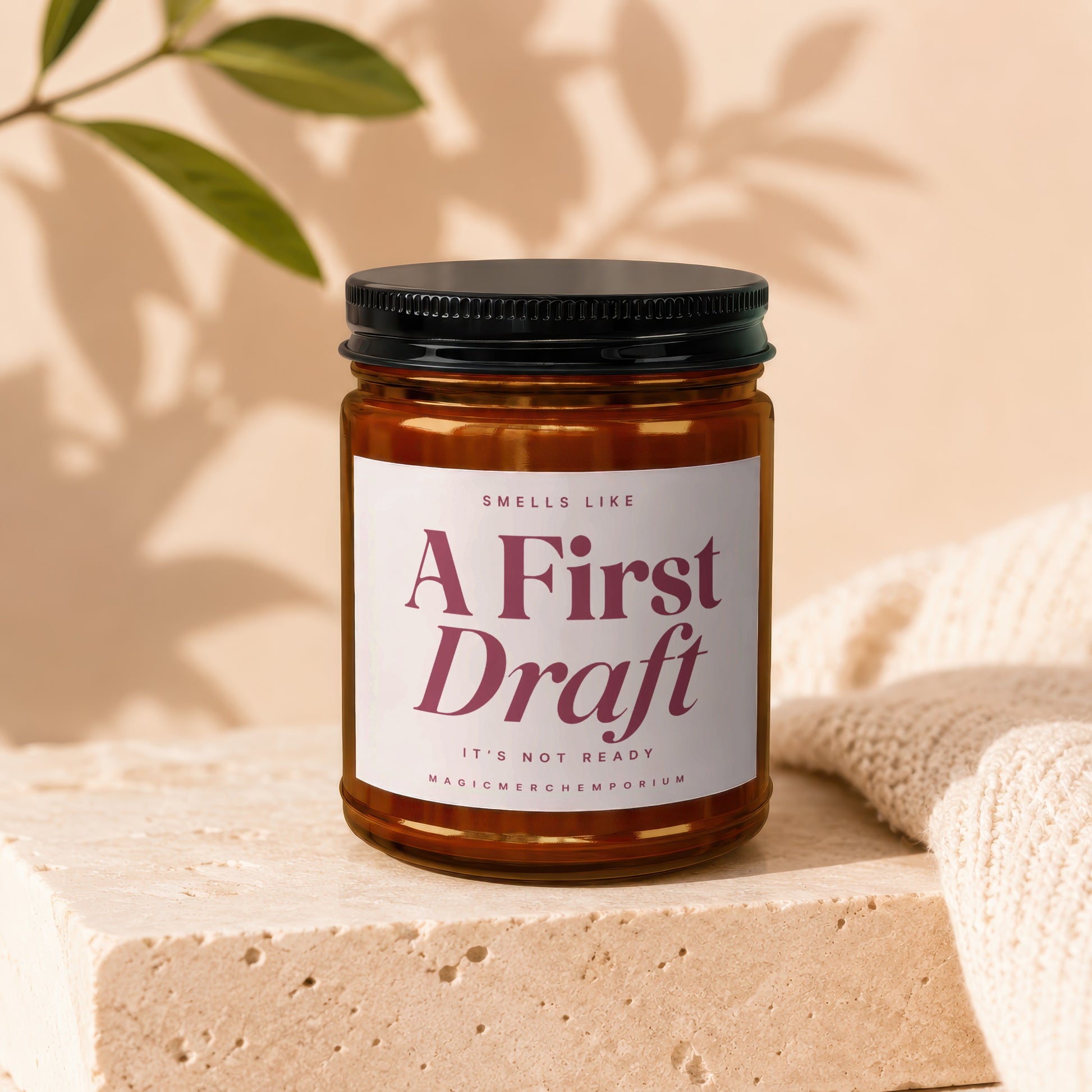 Amber glass candle labeled "A First Draft, It's Not Ready" by MAGICMERCHEMPORIUM.