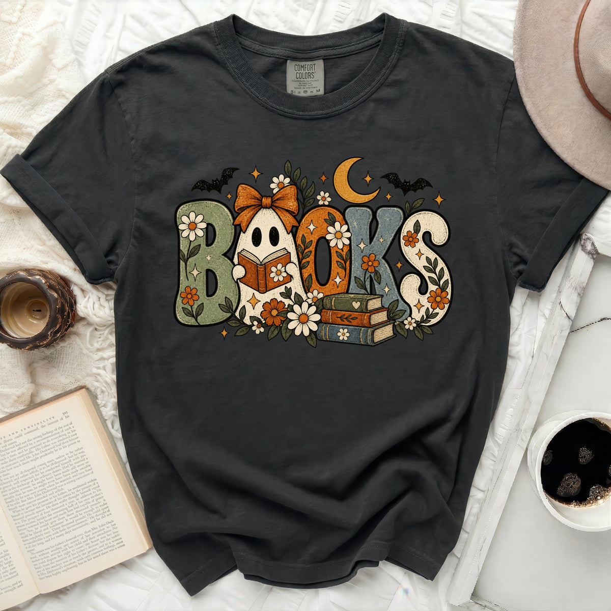 Ghost holding book with the word BOOKS and fall accents on dark t-shirt.