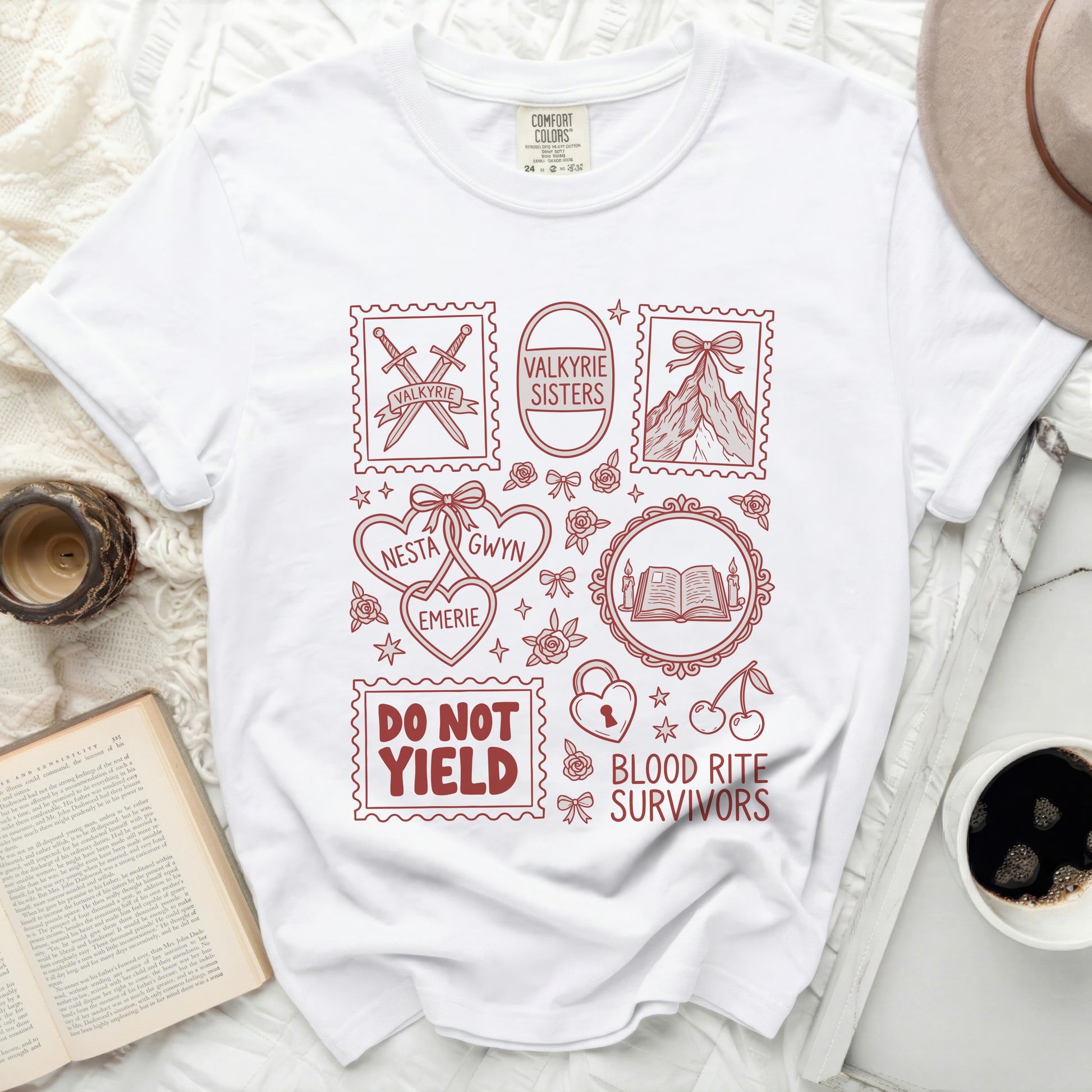 White t-shirt with red line art graphics including swords, mountains, books, and text.